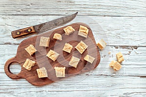 Squares of Delicious Homemade Peanut Butter Fudge with Knife