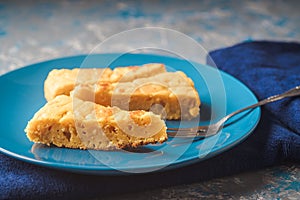Squash and cheese cake on a plate on a blue cloth photo