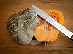 Squash on a cutting board with a kinfe