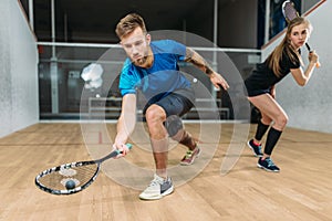 Squash game training, players with rackets