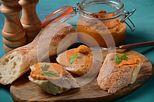 Squash puree squash caviar in a glass jar and on  slices of bread.