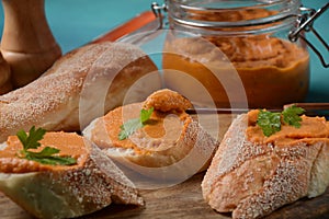 Squash puree squash caviar in a glass jar and on  slices of bread.