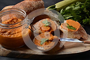 Squash puree squash caviar in a glass jar and on  slices of bread