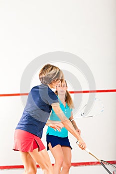 Squash racket sport in gym, women competition