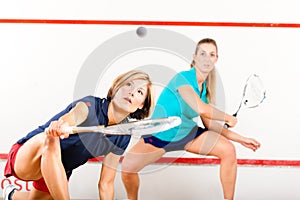 Squash racket sport in gym, women competition