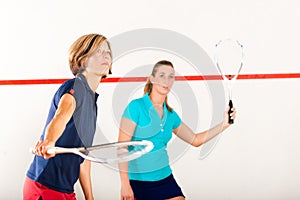 Squash racket sport in gym, women competition