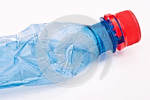 Squashed plastic blue bottle