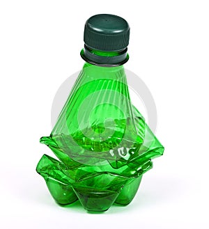 Squashed plastic green bottle