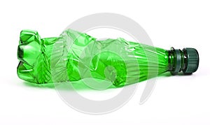 Squashed plastic green bottle