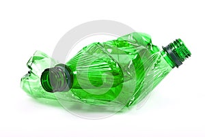 Squashed plastic green bottles