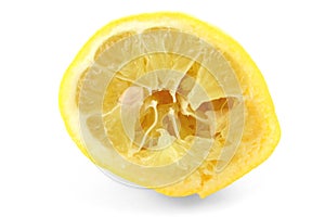 Squeezed out lemon on white