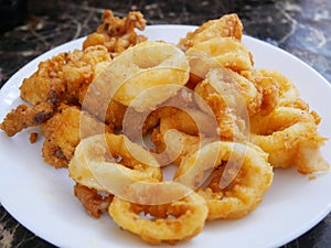 Squid cut into small pieces and fried with flour.