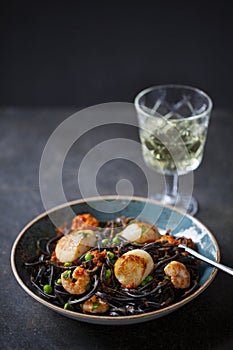 Squid ink pasta with prawns and scallops