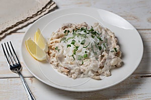 Squid in sour cream sauce. Greek national dish.