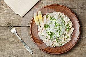 Squid in sour cream sauce. Greek national dish. The view from the top. Copy-space.