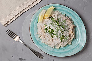 Squid in sour cream sauce. Greek national dish. The view from the top. Copy-space.