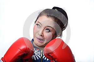 Squint eyed crazy woman in boxing gloves