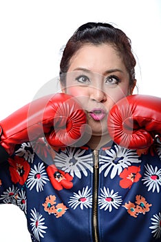 Squint eyed crazy woman in boxing gloves photo