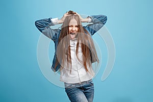 The squint eyed teen girl with weird expression isolated on blue