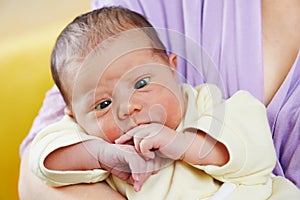 Squint of newborn baby photo