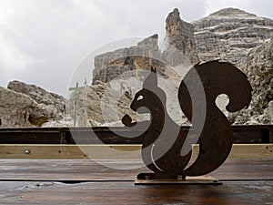 Squirrel silhouette in tofane dolomites mountains panorama photo