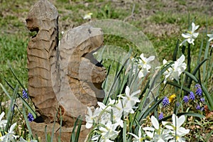 Squirrell sculpture with flowers