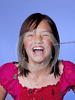 Squirted with stream of water.