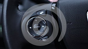 SRC - Source in a modern car on the multifunction steering wheel
