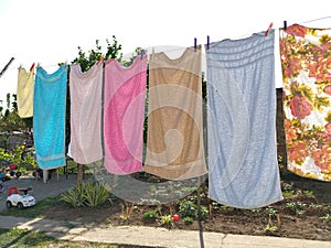 Sremska Mitrovica, Serbia July 10, 2020, towels and clothes dry on a rope. Housewife worries. The wet cloth is hung on