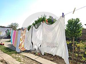 Sremska Mitrovica, Serbia July 10, 2020, towels and clothes dry on a rope. Housewife worries. The wet cloth is hung on