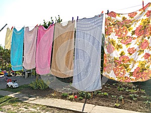 Sremska Mitrovica, Serbia July 10, 2020, towels and clothes dry on a rope. Housewife worries. The wet cloth is hung on clothespins