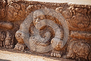 Sri Lanka, Anuradhapura. Mythological character on stone wall of