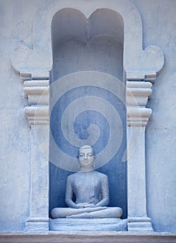 Sri Lanka, Anuradhapura. Old Buddha Statue in Exterior of the Te