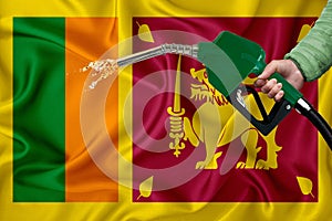 SRI LANKA flag Close-up shot on waving background texture with Fuel pump nozzle in hand. The concept of design solutions. 3d