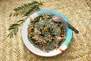 Sri Lankan-style Tempered Drumstick leaves (Murunga Kola curry) with onion stir-fry
