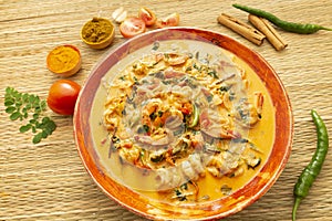 Sri Lankan traditional Style coconut milk prawn curry with ingredients photo