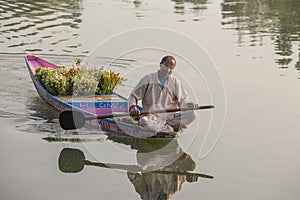 Lifestyle in Dal lake, local people use Shikara, a small boat for transportation in the lake of Srinagar, Jammu and Kashmir state