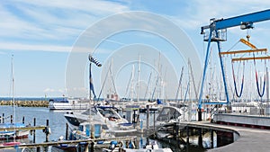 Ssailing yachts at a port of Baltic Sea. Yacht hoist. Northern Germany, coast of Baltic Sea