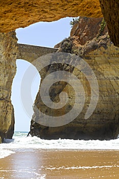 SStone footbridge at Estudiantes beach in Lagos, Portugal