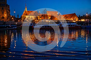 St. Agnes Monastery, river Vltava and boat, night in Prague