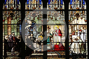 St. Aloysius Gonzaga receiving first communion from the hands of Saint Charles Borromeo photo