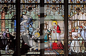 St. Aloysius Gonzaga receiving first communion from the hands of Saint Charles Borromeo photo