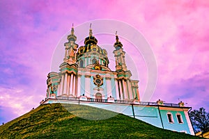 St. Andrew`s Church, Kiev, Ukraine on a cloudy violet background in an overcast day