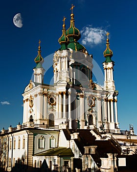 St. Andrew`s church in Kyiv against blue sky on sunny day. Five-domed church in baroque style