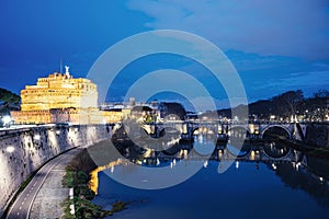 St. Angelo castle and bridge at night in Rome, Italy