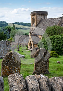 St Barnabas Anglican church, surrounded by a graveyard, in the picturesque English Cotswold village of Snowsill, Gloucestershire.