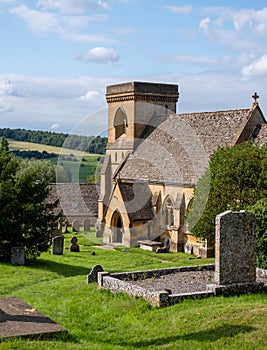 St Barnabas Anglican church, surrounded by a graveyard, in the picturesque English Cotswold village of Snowsill, Gloucestershire.