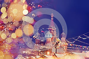 St. Basil Cathedral on Red Square in Moscow, bokeh christmas light of lanterns on winter night