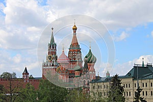 St. Basil`s Cathedral and the Kremlin Spasskaya tower on red square in Moscow Russia