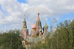 St. Basil`s Cathedral and the Kremlin Spasskaya tower on red square in Moscow Russia